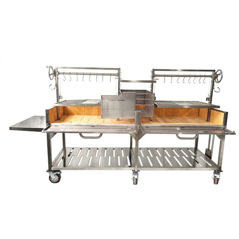 Open Fire Grill Tagwood BBQ24SS Double Argentine Santa Maria Grill 304 SS - Shared firebox - Height-adjustable grates - Interchangeable griddle -Meat hooks - Foldable side table and 6 heavy-duty swivel casters - PRE-ORDER
