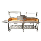 Open Fire Grill Tagwood BBQ24SS Double Argentine Santa Maria Grill 304 SS - Shared firebox - Height-adjustable grates - Interchangeable griddle -Meat hooks - Foldable side table and 6 heavy-duty swivel casters - PRE-ORDER