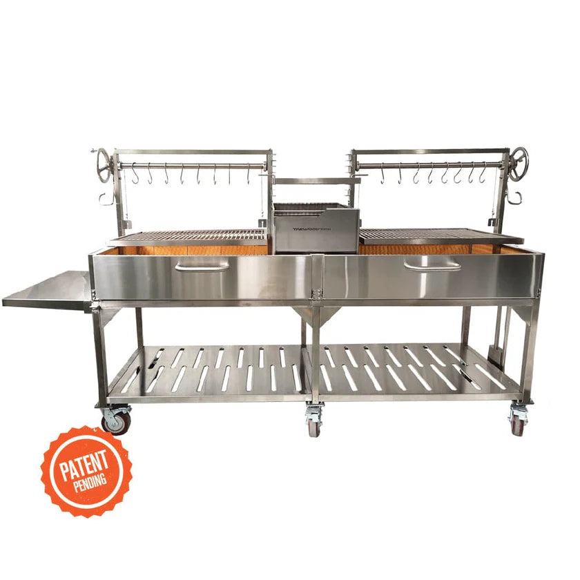 Open Fire Grill Tagwood BBQ24SS Double Argentine Santa Maria Grill 304 SS - Shared firebox - Height-adjustable grates - Interchangeable griddle -Meat hooks - Foldable side table and 6 heavy-duty swivel casters - PRE-ORDER